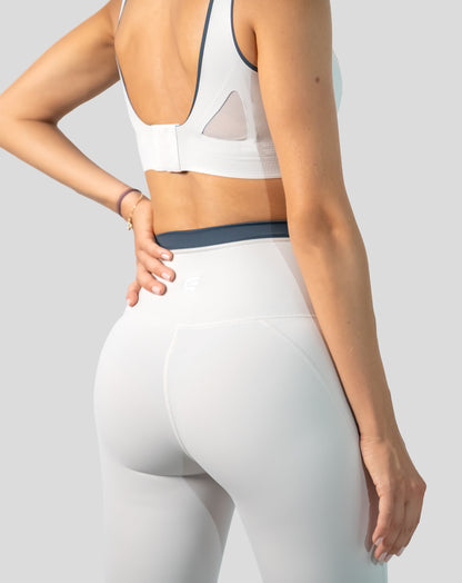 Close-up of white gym set for women leggings showing back waistband and minimal seams