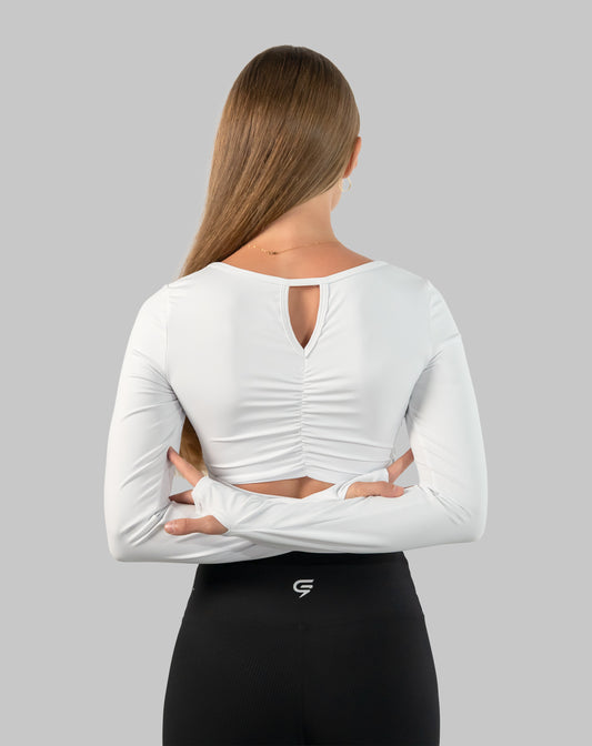 White gym top back view highlighting ruched spine and back keyhole cut-out