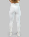 White leggings with high waisted scallop waistband, ankle length; back view