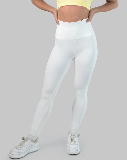 White leggings with high waisted scallop waistband, ankle length; front view