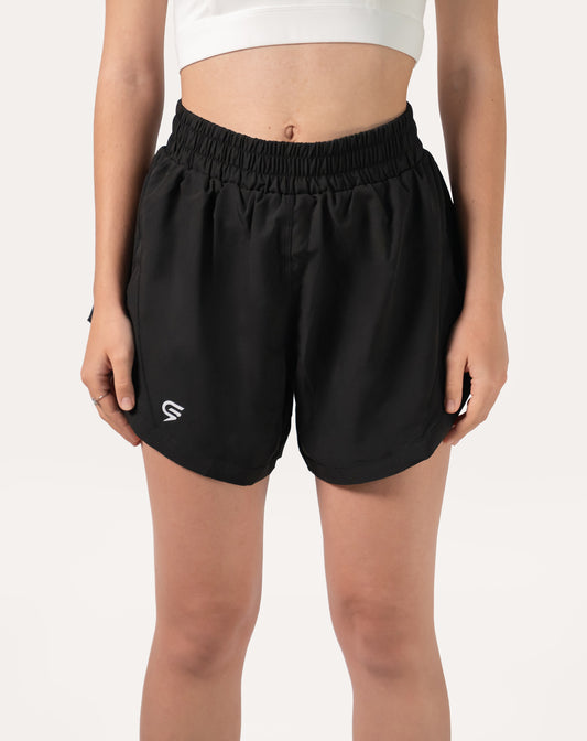 Front close-up of black women's 2-in-1 running shorts with elastic waistband and curved split hem
