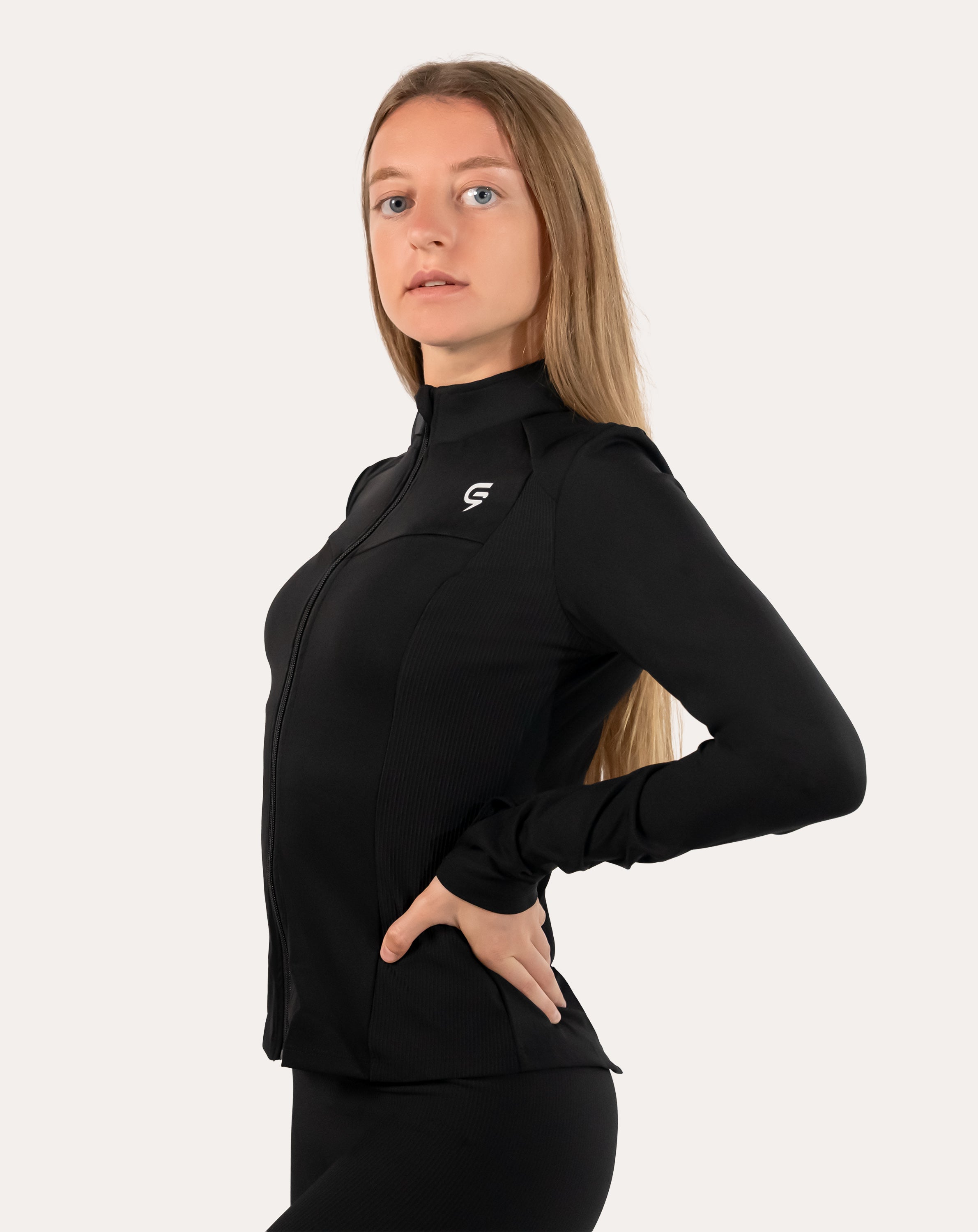 Women’s black gym jacket, front view zipped with small chest logo