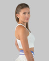 Side profile of a white ribbed women’s gym crop top with high crew neck and cropped hem designed for mobility and breathability