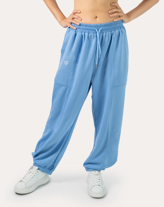 Sky-blue women’s gym joggers, front view with high waist and cuffed ankles