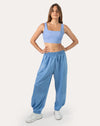 Front view of sky blue women’s gym joggers with high waist and tapered legs