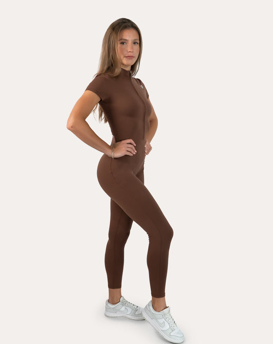 Brown women’s gym jumpsuit with zip front, front right three-quarter view