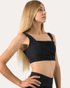 Close-up of black womens gym set bra showing square neckline and breathable straps