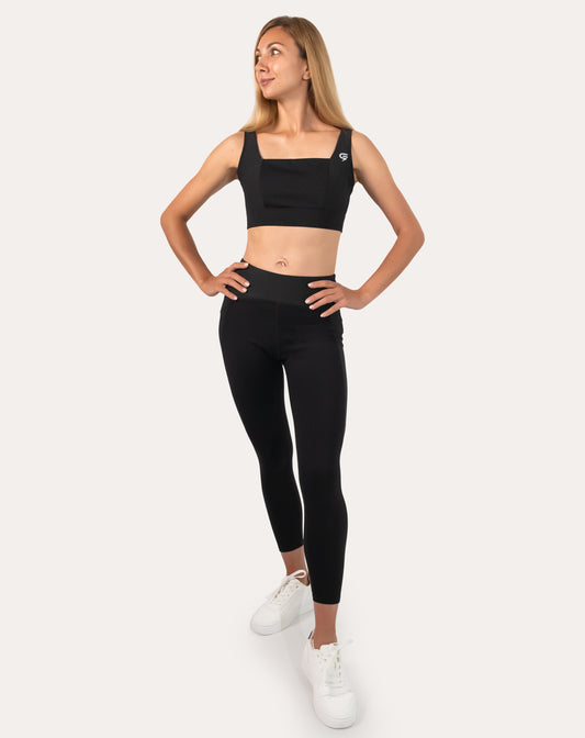 Black womens gym set, three-quarter front view with square-neck bra and high-waist leggings