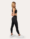 Black womens gym set side profile showing square-neck bra and sculpting leggings