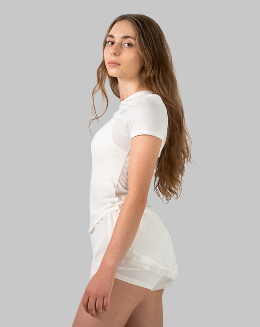 Women's gym set in white, side view highlighting airy tee fit