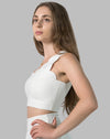 Women’s gym skirt set in white, close-up of one-shoulder scallop crop