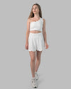 Women’s gym skirt set in white, one-shoulder scallop crop and flared skirt