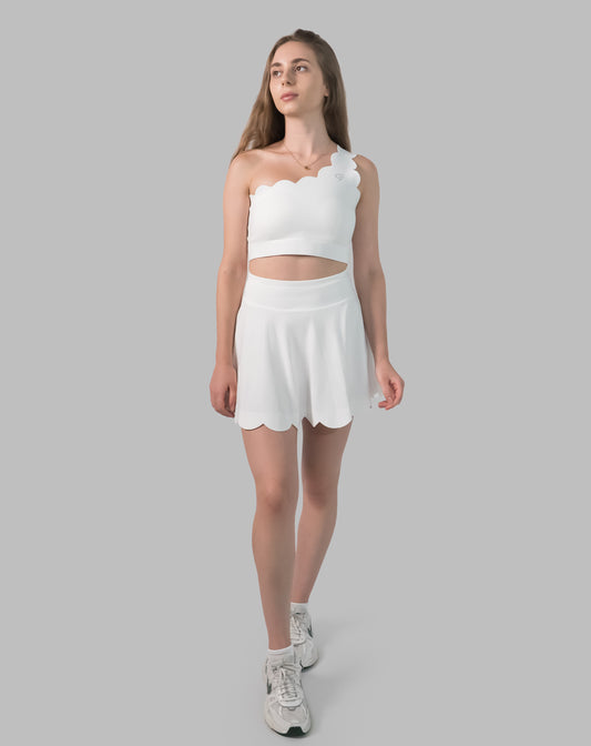 Women’s gym skirt set in white, one-shoulder scallop crop and flared skirt