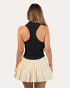 Black womens gym tank top in three-quarter back pose with collared V-neck