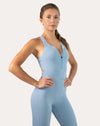 Sky blue women’s jumpsuit with zip-front, front right three-quarter view showing contoured fit