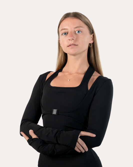 Black long sleeve gym top womens, front close-up with square neck, buckle detail and thumbholes