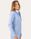 Side profile of the powder blue women’s running jacket showing stand collar and clean lines