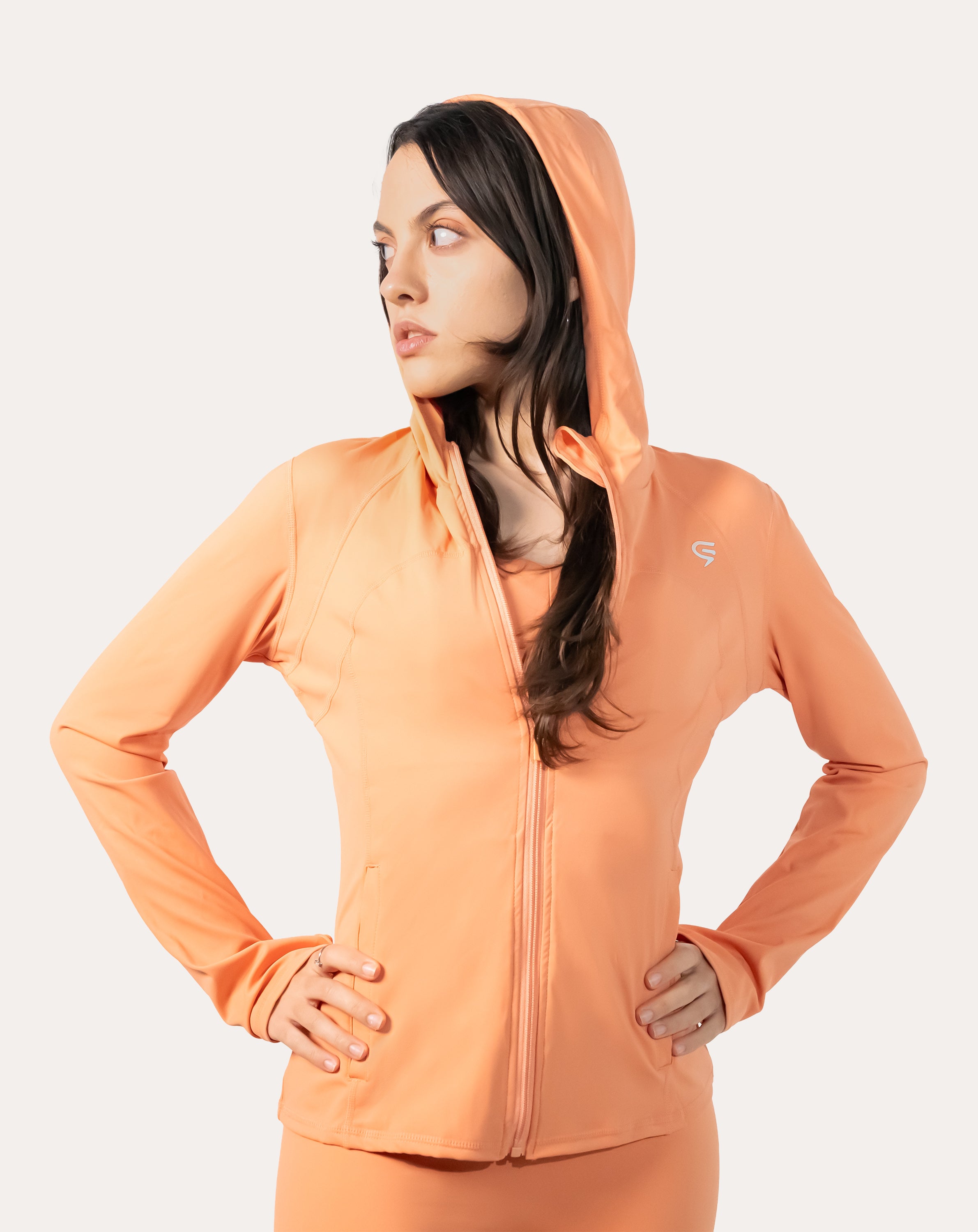 Apricot women’s zip-up jacket, back view with hood up and clean hem