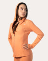 Apricot women’s zip-up jacket, front three-quarter view with streamlined fit and thumbhole cuffs