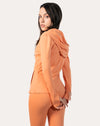 Apricot women’s zip-up jacket, right side profile with hood up