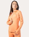 Apricot women’s zip-up jacket, front close-up showing full-zip and stand collar