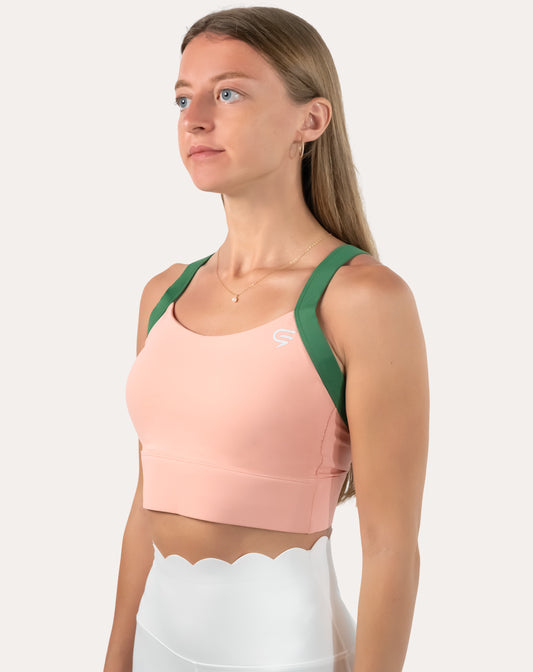 Peach and green yoga sports bra, front three-quarter close-up with longline band and wide straps